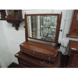 An Edwardian mahogany toilet swing mirror having three drawers