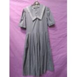 Vintage Laura Ashley navy blue dress having sailor collar and polka dot print. Good condition,