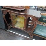 A Victorian stained frame chiffonier base having central mirror door flanked by recess and shaped