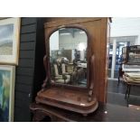 A Victorian mahogany toilet/swing mirror having scroll frame