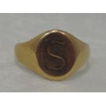 A gents yellow metal signet ring bearing monogram 'S', marks worn, tested as 18ct gold, size R