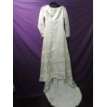 1960s wedding dress having lace detailing, long sleeves and train. Good condition, lovely quality,