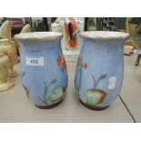 A pair of Crown Ducal vases having naturalistic decoration on blue ground