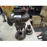 A late 19th century Chinese bronze censor burner having dog of fo lid, on trefoil integral stand