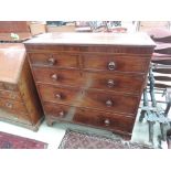 An early 19th century mahogany chest of two short and three long cockbeaded drawers, on bracket feet