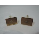 A cased pair of gents 9ct gold cufflinks of rectangular form having bark effect decoration and