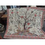 A huge throw/bed covering having a wonderful oriental type print with flowers vines and birds etc, a