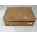 A leather jewellery box having green velvet interior containing a small selection of costume