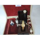 A vintage jewellery box containing a small selection of wrist watches including Seiko 330176, Buler,