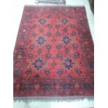 A late 20th century rug of Turkmen style having red ground, 198 x 150cm