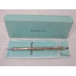 A Tiffany & Co silver ball point pen having striped decoration and stamped Cross sterling silver,