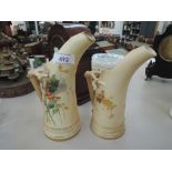 Two Royal Worcester horn jugs having painted decorative shape number 1116 on blush ground