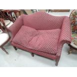 A 20th century mahogany frame period style settee having burgundy pattern upholstery