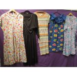 A lot of five vintage 70s and 80s dresses, mixed styles and sizes, all in good condition.