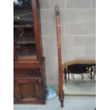 A vintage mahogany curtain pole and fitments