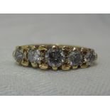 A lady's dress ring having five graduated old cut diamonds, total approx 1ct in a gallery mount on