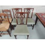 A set of three Edwardian mahogany dining chairs, having vase splats with later overstuffed seats and