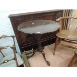 An early 20th century mahogany pedestal table in the Georgian style having circular pie crust flip