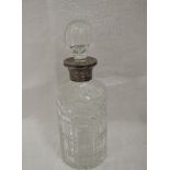 A cut glass decanter of cylindrical form having silver collar, hallmarks worn but bearing makers