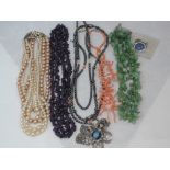 A small selection of beads including simulated pearls, branch coral, amethyst style, hematite etc