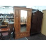 A late 19th century part pitch pine mirror door wardrobe with drawer under