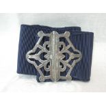 An Edwardian silver nurse's buckle of pierced hexagonal form on a blue material belt, Birmingham