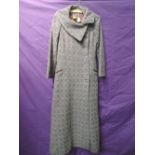 A vintage full length BIBA coat in purple, blue and grey wool. Great condition with a few nips to