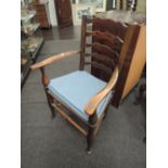 A set of 7 (6+1) 20th century part elm vernacular kitchen dining chairs having wave ladder backs,