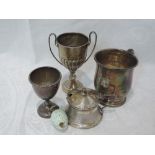 A selection of HM silver including a small trophy, mustard, egg cup, christening mug and porcelain