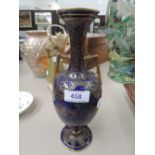 A 19th century Doulton Burslem gilt heightened bottle vase, having naturalistic decoration on blue