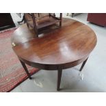 A pair of early 19th century mahogany D ends to form circular dining table, on square tapered legs