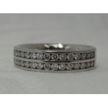 A lady's half eternity ring having a double row of channel set diamonds, total approx 0.75ct on a