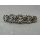 A lady's dress ring having five graduated old cut diamonds, total approx 1ct in a claw set basket