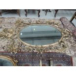 A 20th century gilt wood wall mirror in the Roccoco style