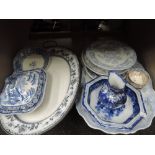 A selection of blue and white ceramics including asiatic Pheasant platters, tureen, serving dish