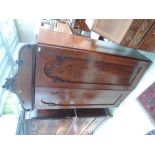 A mid Victorian flame mahogany wardrobe top having crest over