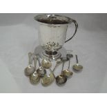 A silver mug of plain form having loop handle and pedestal foot, London 1938, Robert Pringle, and