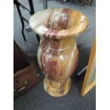 A large alabaster urn of baluster form