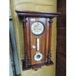 A late 19th century mahogany and walnut Vienna style wall clock having thermometer and barometer