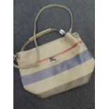 Large handbag bearing Burberry branding in beige blue and red.good condition.