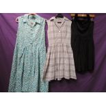 Two vintage 1950s dresses and one early 60s, a gingham shirtwaister and one with blue rose print and