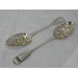 A pair of William IV silver berry spoons of fiddle back form having bright cut decoration to