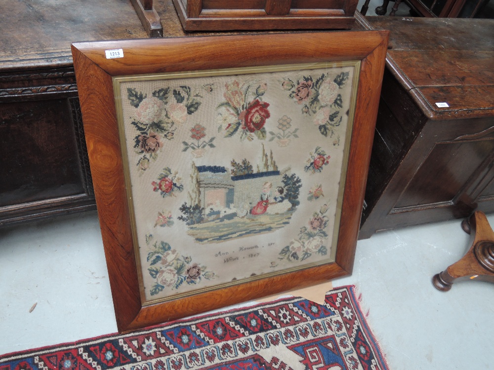 A Victorian woolwork sampler having pictorial decoration by Ann Haworth, 1857