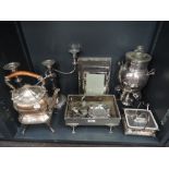 A selection of silver plate including two spirit kettles, photograph frames, candelabrum, planter