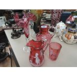A selection of cranberry glass including Mary Gregory style