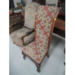 A Victorian mahogany prie dieu chair having acanthus carved decoration and woolwork upholstery on