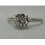 A lady's diamond solitaire dress ring, approx 1.5ct in a claw set mount to knife blade shoulders