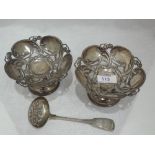 A pair of Edwardian silver bon bon dishes having moulded art nouveau style decoration to bowls on