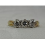 A lady's dress ring having a trilogy of diamonds, total approx 0.80ct in a claw set mount to moulded