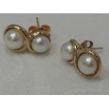 A pair of 9ct gold and cultured double pearl stud earrings